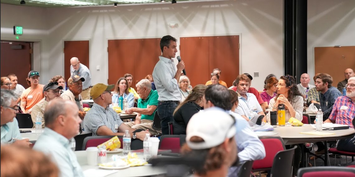 Luke Macaulay speaking at a workshop